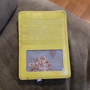 Small yellow hobo international wallet. Excellent condition. Small flaw-pictured